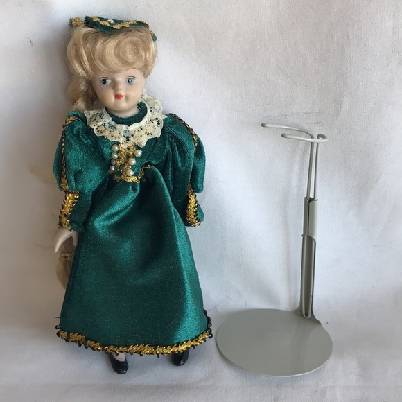 Vintage 8” porcelain doll with green dress on display stand - Picture 5 of 7